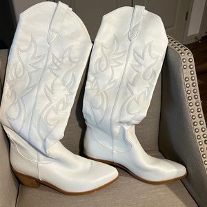 Tall white cowboy boots